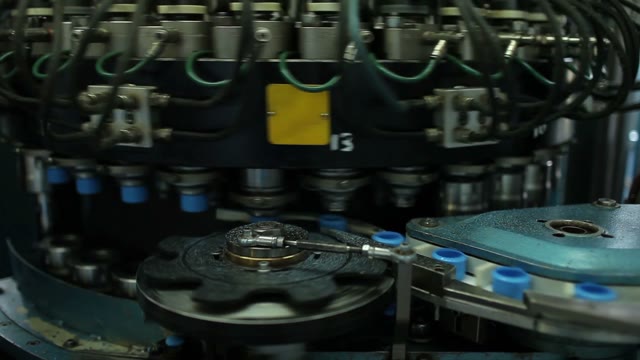 Close-up Of The Machine, Producing Plastic Bottle Caps.