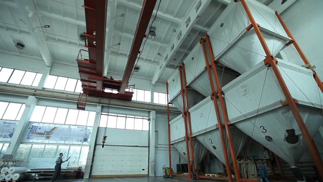 Industrial Crane At Work. Working With A Remote Control