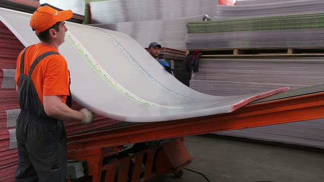 Workers Loaded Polycarbonate Sheets To The Tape