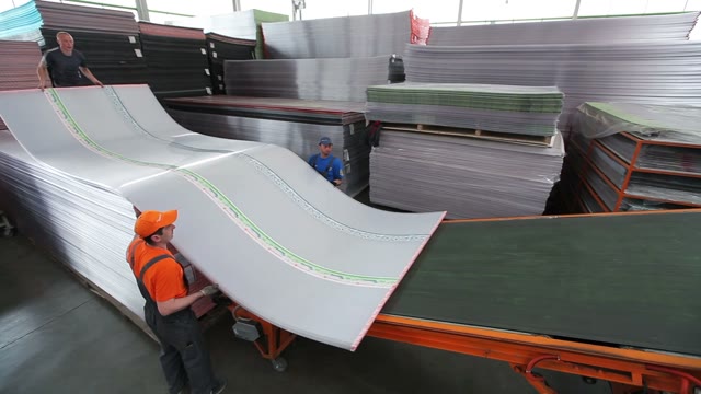Workers Loaded Polycarbonate Sheets To The Tape