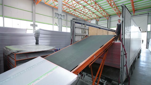 Workers Loaded Polycarbonate Sheets In The Truck