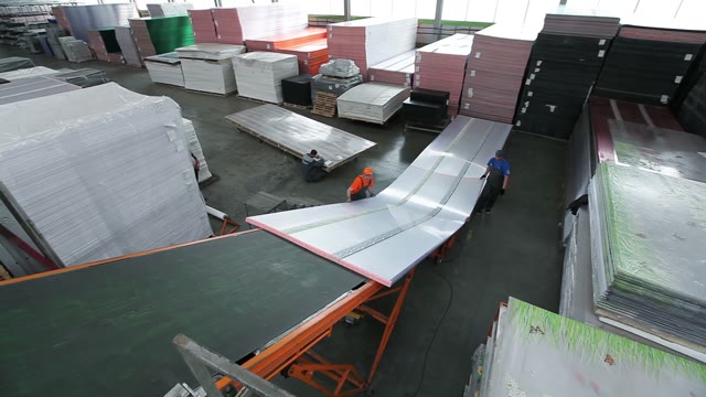 Workers Loaded Polycarbonate Sheets In The Truck
