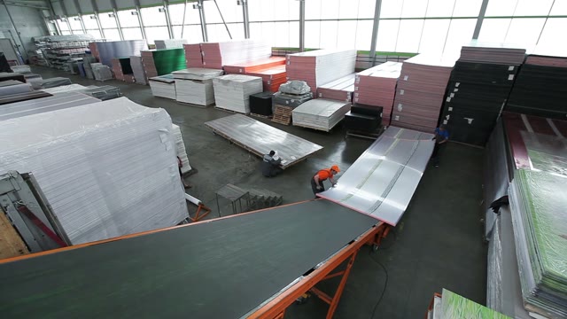 Workers Loaded Polycarbonate Sheets In The Truck