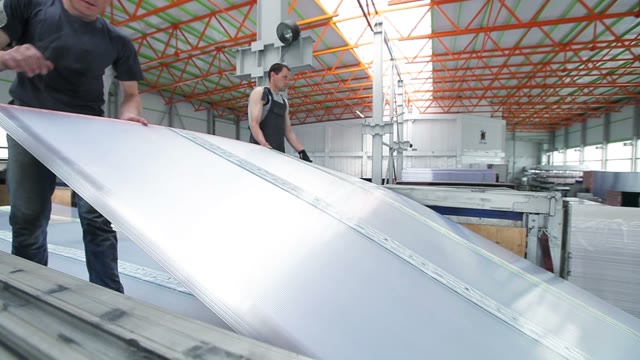 Workers Loaded Polycarbonate Sheets In The Truck