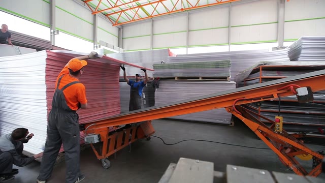 Workers Loaded Polycarbonate Sheets To The Tape