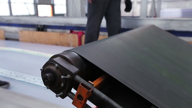 Workers Loaded Polycarbonate Sheets In The Truck. Close-up Of Loading Tape