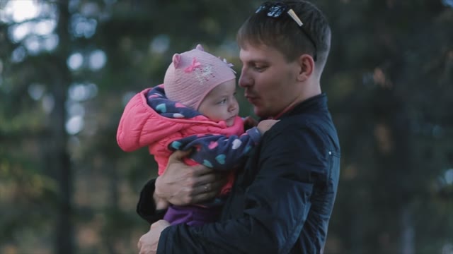 In The Autumn Forest Father Playing With His Daughter.