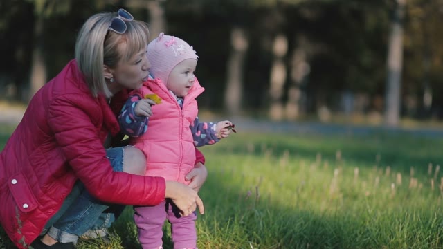 Mother Hugging Her Little Daughter, And That It Shows The Hand.
