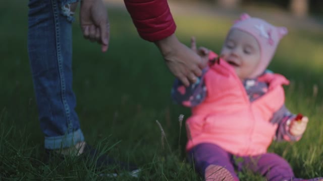 Mother Gives A Flower To Little Child, And She Wants To Eat Him.