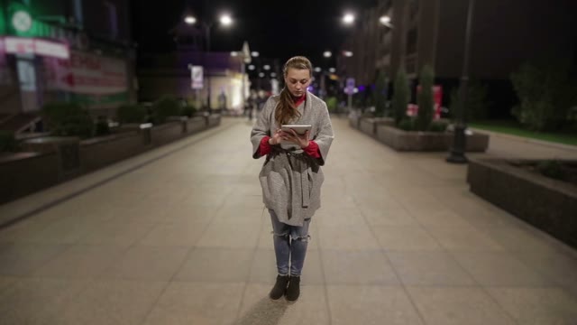 Girl In Real Time Using Tablet On The Street Timelapse Background.