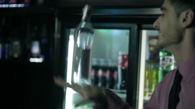 Barman Shows Trick With A Bottle.