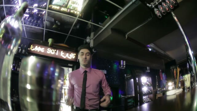 Bartender Shows Trick With A Glass Bottle
