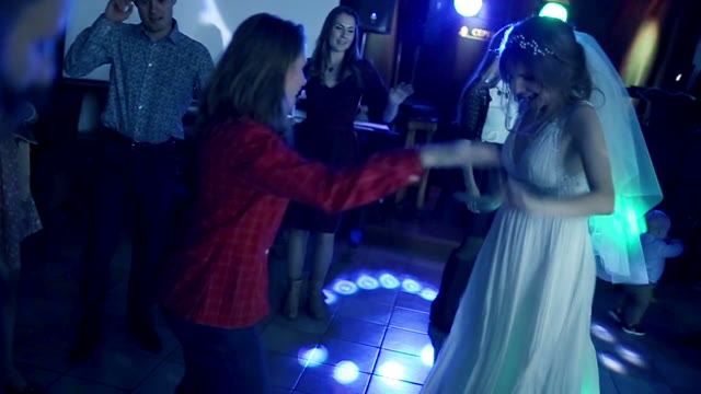 Bride Dancing With The Guests On The Dance Floor