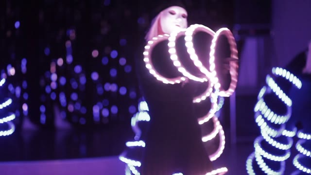 Girls Dancing In Shining Costumes At The Club