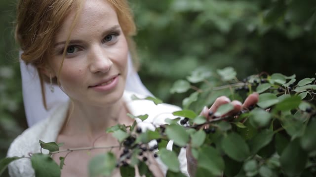 The Bride With A Veil Considers Berries.