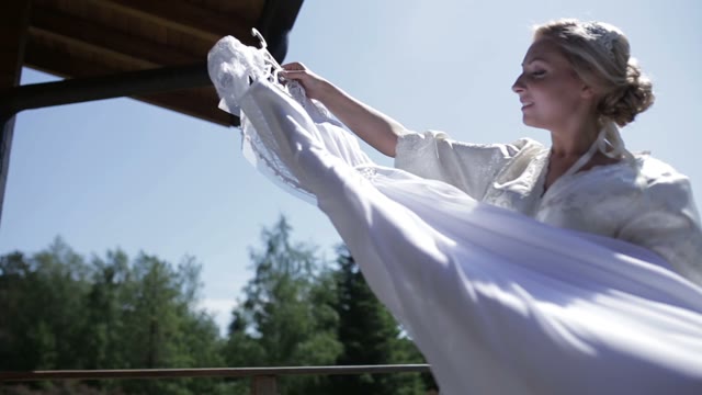 Beautiful Bride Is Considering A Wedding Dress.
