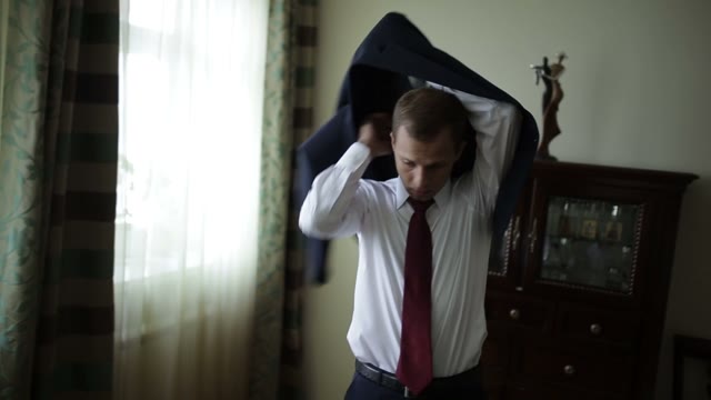 The Groom Wears A Jacket Before The Wedding.