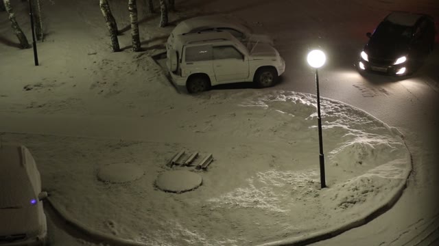 Snow-covered Courtyard At Evening. View From The Window