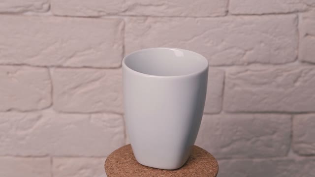 The Cup Of Coffee Is Poured. Glass Revolves Around Its Axis.