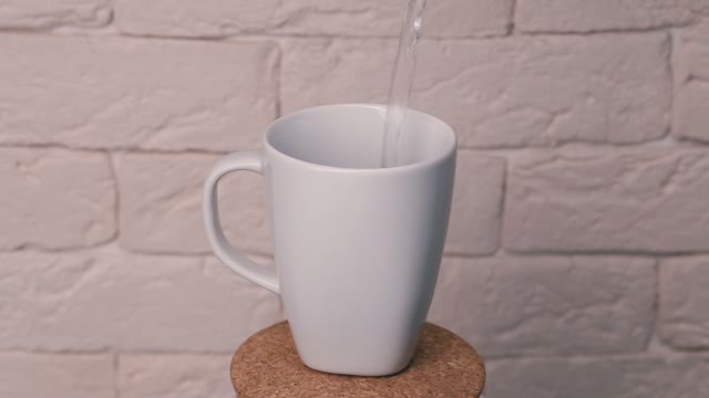 Coffee Is Poured Boiling Water. Glass Revolves Around Its Axis.