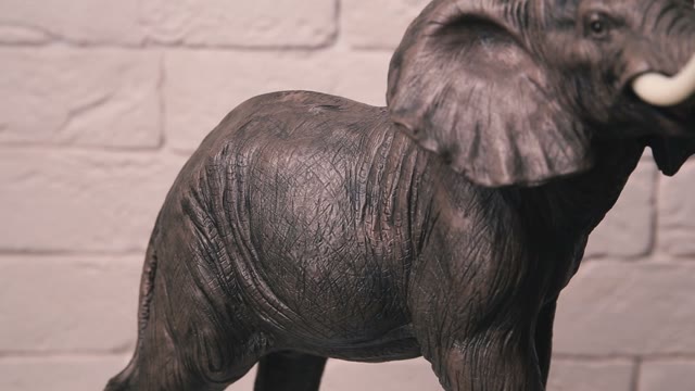 Statuette Elephant Spins Around Its Axis.