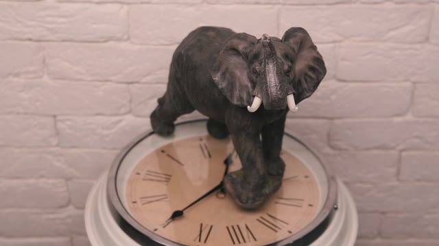Statuette Of An Elephant Standing On The Watch Dial And Spinning.