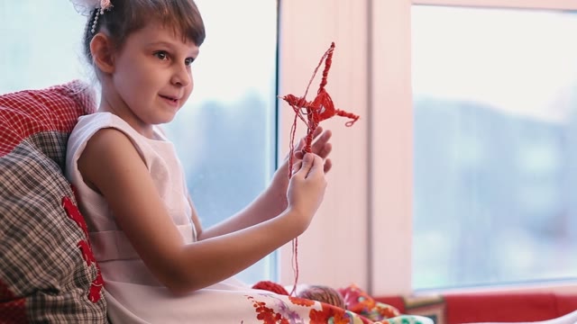 Little Girl In White Shows His Crafts.