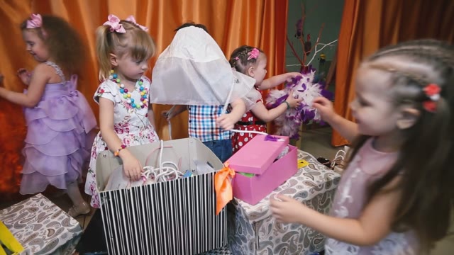Young Children In A Creative Mug Dismantle The Props.
