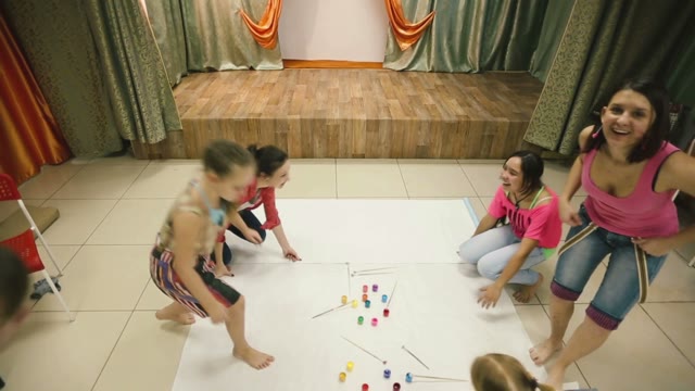 Little Funny Girls Sit On The Floor And Are Going To Draw.
