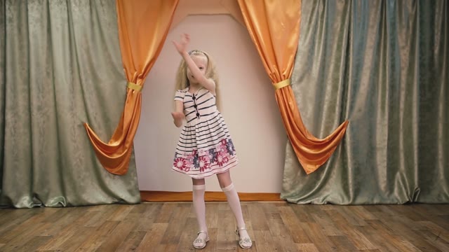 Little Girl Shows The Performance On Stage.