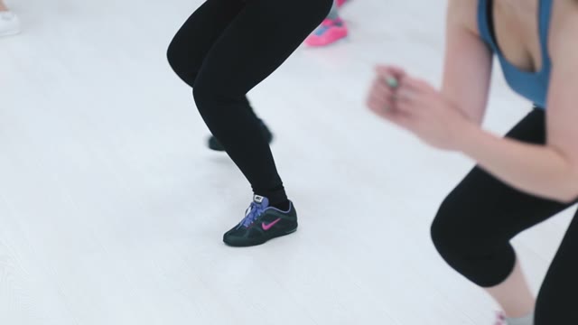 The Girl In A Pink T-shirt In Training On Fitness.
