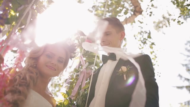The Groom Throws A Bride On A Swing.