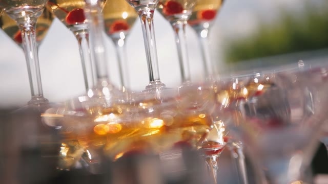 A Pyramid Of Wine Glasses With Champagne On The Table.
