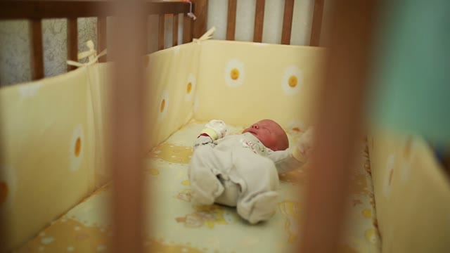 Newborn Waving His Arms And Legs, Yawning During Sleep.