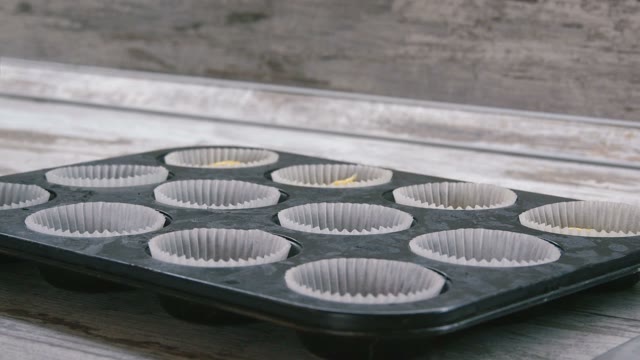 Preparation Of Cake. Expanding The Dough For The Cake Pan. Close-up.
