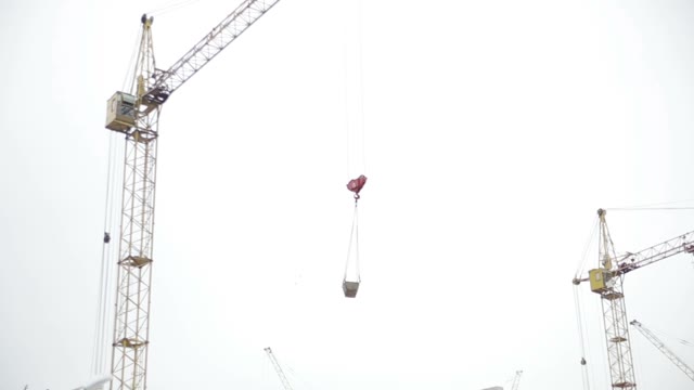 Cranes At A Construction Site. Builders.