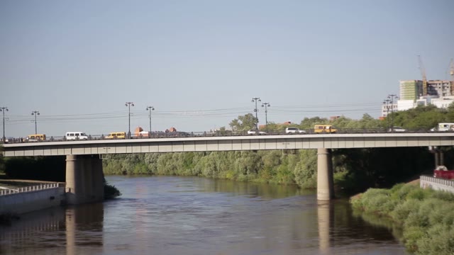 City Traffic. View Of The Bridge Embankment.