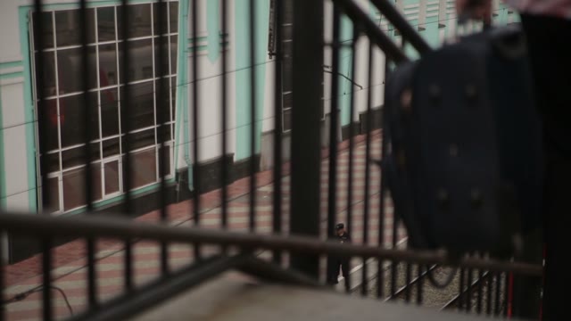 People Go Down To The Train Station Stairs.