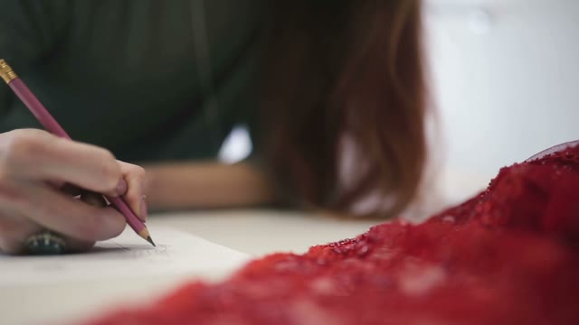 The Girl Draws Pencil Sketch On Paper. Close-up.