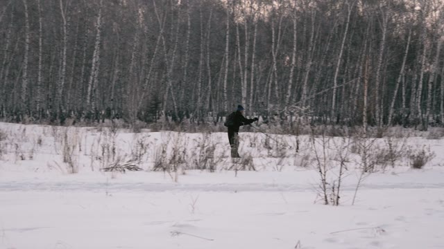 Man Riding On Skis In The Woods. Slow Motin