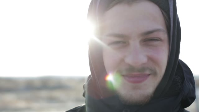 Young Man Smiling And Looking At The Camera. Close-up