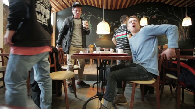 Young People Get Up From The Table And Leave. Cafe
