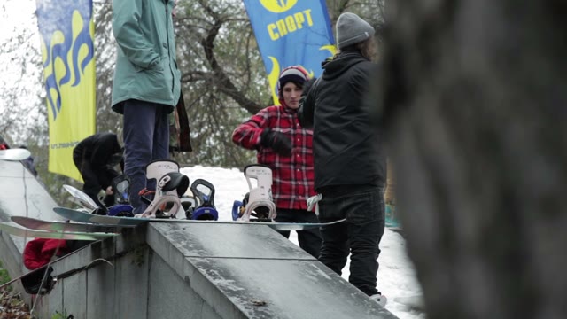 Snowboarders Warm Up Before Skiing