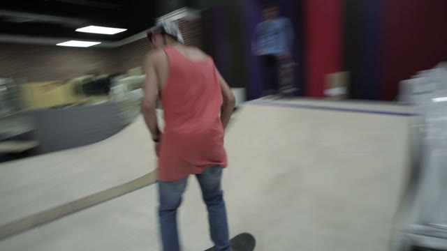 Skateboarder Riding In The Mini Ramp