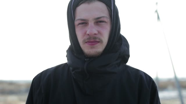 Young Man Looking Into The Camera. Close-up