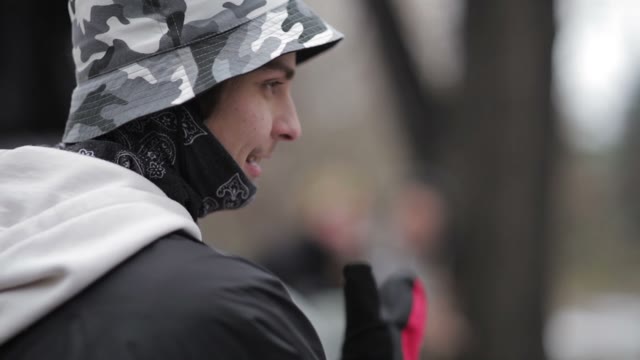 The Young Man Slips On A Handrail On A Snowboard