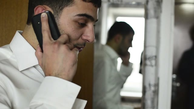 Young People Of Caucasian Nationality Talking On The Phone. Close-up