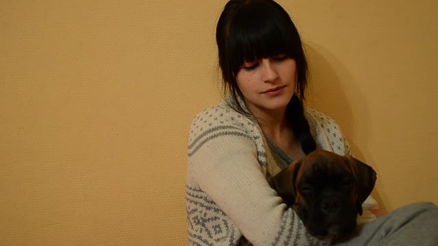 Young Brunette Hugging A Dog. Close-up