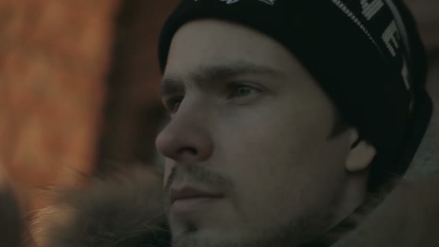 Young Man In A Cap. The Face Close Up. Winter