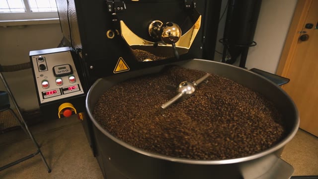 Coffee Machine Mixes Coffee Beans. Close-up